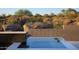 Reflecting pool in desert backyard featuring rock outcroppings and natural plants at 9750 E Troon North Dr, Scottsdale, AZ 85262