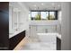 Luxury bathroom with freestanding tub, walk-in shower, double vanity, and modern fixtures at 9750 E Troon North Dr, Scottsdale, AZ 85262