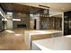 Bright, open great room featuring natural light, hardwood floors, and stone accent wall at 9750 E Troon North Dr, Scottsdale, AZ 85262