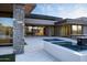 Expansive outdoor patio featuring a pool, spa, and seamless indoor-outdoor living at 9750 E Troon North Dr, Scottsdale, AZ 85262