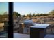 A sleek outdoor grill area showcases modern design and outdoor living at 9750 E Troon North Dr, Scottsdale, AZ 85262