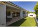 Outdoor living space with artificial turf and a covered patio featuring lounge seating at 10127 E Tillman Ave, Mesa, AZ 85212