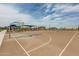 Spacious basketball court with multiple hoops, shaded areas, and well-maintained playing surface at 10127 E Tillman Ave, Mesa, AZ 85212