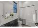 Updated bathroom with modern vanity, bathtub and shower at 10127 E Tillman Ave, Mesa, AZ 85212