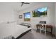 Bedroom features a modern desk, mountain views, and ample natural light at 10127 E Tillman Ave, Mesa, AZ 85212