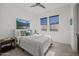 Bedroom features a large window and ceiling fan at 10127 E Tillman Ave, Mesa, AZ 85212