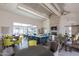Spacious clubhouse featuring a central island with bar seating, a cozy fireplace, and ample seating areas at 10127 E Tillman Ave, Mesa, AZ 85212