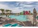 Large community pool with a waterslide, ample seating, and beautifully landscaped surroundings at 10127 E Tillman Ave, Mesa, AZ 85212