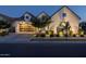 Charming exterior of a modern home featuring manicured landscaping, exterior lighting, and sleek architectural design at 10127 E Tillman Ave, Mesa, AZ 85212