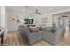 Bright and airy living room featuring two large sofas, contemporary decor, and hardwood floors at 10127 E Tillman Ave, Mesa, AZ 85212