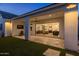 Spacious outdoor patio with ceiling fan, lighting, and comfortable seating, seamlessly connecting to the indoors at 10127 E Tillman Ave, Mesa, AZ 85212