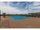 Well-maintained community tennis court with professional surfacing, complete with seating and fencing at 10127 E Tillman Ave, Mesa, AZ 85212