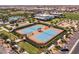 Aerial view of the community tennis courts and surrounding green spaces at 10127 E Tillman Ave, Mesa, AZ 85212