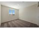 Bright bedroom featuring carpet floors and a window with blinds letting in natural light at 1074 W West Virginia Ave, Florence, AZ 85132