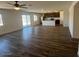 Open concept living space featuring luxury vinyl plank floors and modern kitchen at 1074 W West Virginia Ave, Florence, AZ 85132