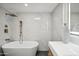 Elegant bathroom with a soaking tub, luxurious shower fixtures, and vanity at 11079 N 110Th Pl, Scottsdale, AZ 85259