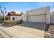 Single-story home featuring a two-car garage and desert landscaping at 11079 N 110Th Pl, Scottsdale, AZ 85259