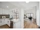 Open kitchen with stainless steel appliances and view into the living room at 11079 N 110Th Pl, Scottsdale, AZ 85259