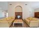 Cozy lounge area with a decorative fireplace and comfortable couches, perfect for relaxation at 11079 N 110Th Pl, Scottsdale, AZ 85259