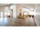 Spacious lounge area with light wood floors, couches, and tables, perfect for community gatherings at 11079 N 110Th Pl, Scottsdale, AZ 85259