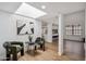 Sitting room near kitchen features a skylight, modern decor and wood-look floors at 11079 N 110Th Pl, Scottsdale, AZ 85259