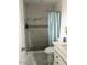 Modern bathroom featuring a tiled shower with a stylish curtain at 11250 N 33Rd Ave, Phoenix, AZ 85029