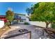 The backyard boasts stone flooring, a fire pit, and views of the two story home with balcony at 1134 E Driftwood Dr, Tempe, AZ 85283