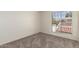 Neutral bedroom featuring natural light and outdoor view with privacy screen at 1134 E Driftwood Dr, Tempe, AZ 85283