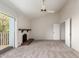 Bedroom featuring a fireplace, ceiling fan, and a sliding door leading to the outside at 1134 E Driftwood Dr, Tempe, AZ 85283