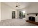Bright bedroom with a fireplace and a sliding door leading to the outside at 1134 E Driftwood Dr, Tempe, AZ 85283