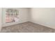 Neutral bedroom with natural light and a large window with privacy screen at 1134 E Driftwood Dr, Tempe, AZ 85283