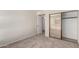 Cozy carpeted bedroom featuring a sliding closet and a connecting door at 1134 E Driftwood Dr, Tempe, AZ 85283