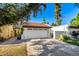 Exterior shot of the home with two garages and well maintained landscaping at 1134 E Driftwood Dr, Tempe, AZ 85283