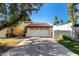 Home featuring a two-car garage and a well-maintained driveway at 1134 E Driftwood Dr, Tempe, AZ 85283