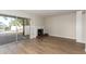 Spacious living room with wood flooring, a fireplace, and a sliding glass door at 1134 E Driftwood Dr, Tempe, AZ 85283