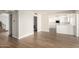 Open-concept living area showcasing wood flooring and a view to the kitchen at 1134 E Driftwood Dr, Tempe, AZ 85283