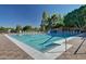 Community outdoor swimming pool with lounge chairs, a diving board and pristine blue water at 1134 E Driftwood Dr, Tempe, AZ 85283