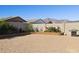 Spacious backyard with desert landscaping, block wall, and mountain views at 12176 E Chevelon Trl, Gold Canyon, AZ 85118