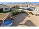 Expansive backyard featuring gravel landscaping, a small pool, and scenic mountain views, creating a relaxing retreat at 12176 E Chevelon Trl, Gold Canyon, AZ 85118