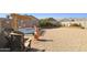 Backyard featuring a pergola, seating area, a stock tank pool and desert landscaping at 12176 E Chevelon Trl, Gold Canyon, AZ 85118