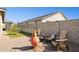Backyard with gravel, grass, seating, and an orange clay fire pit at 12176 E Chevelon Trl, Gold Canyon, AZ 85118