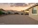 Backyard with low maintenance desert landscaping, BBQ, block wall, and covered patio at 12176 E Chevelon Trl, Gold Canyon, AZ 85118