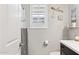 Bathroom with black-and-white checkered shower curtain and decorative accents at 12176 E Chevelon Trl, Gold Canyon, AZ 85118
