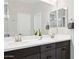 Bright bathroom featuring a double sink vanity with modern fixtures and a large mirror at 12176 E Chevelon Trl, Gold Canyon, AZ 85118
