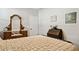 Cozy bedroom with an antique vanity featuring a large mirror, adding vintage charm to the room at 12176 E Chevelon Trl, Gold Canyon, AZ 85118