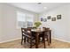 Cozy breakfast nook featuring a dark wooden table with a leather bench and natural lighting at 12176 E Chevelon Trl, Gold Canyon, AZ 85118