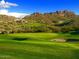 Scenic view of the golf course with rolling hills, bunkers and mountain views in the background at 12176 E Chevelon Trl, Gold Canyon, AZ 85118