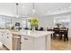 Stylish kitchen open to the living room featuring stainless steel appliances and an island at 12176 E Chevelon Trl, Gold Canyon, AZ 85118