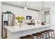 Modern kitchen featuring an island with bar seating, stainless appliances, and white cabinetry at 12176 E Chevelon Trl, Gold Canyon, AZ 85118