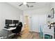 A well lit and well-appointed home office with desk, chair and plentiful storage at 12176 E Chevelon Trl, Gold Canyon, AZ 85118